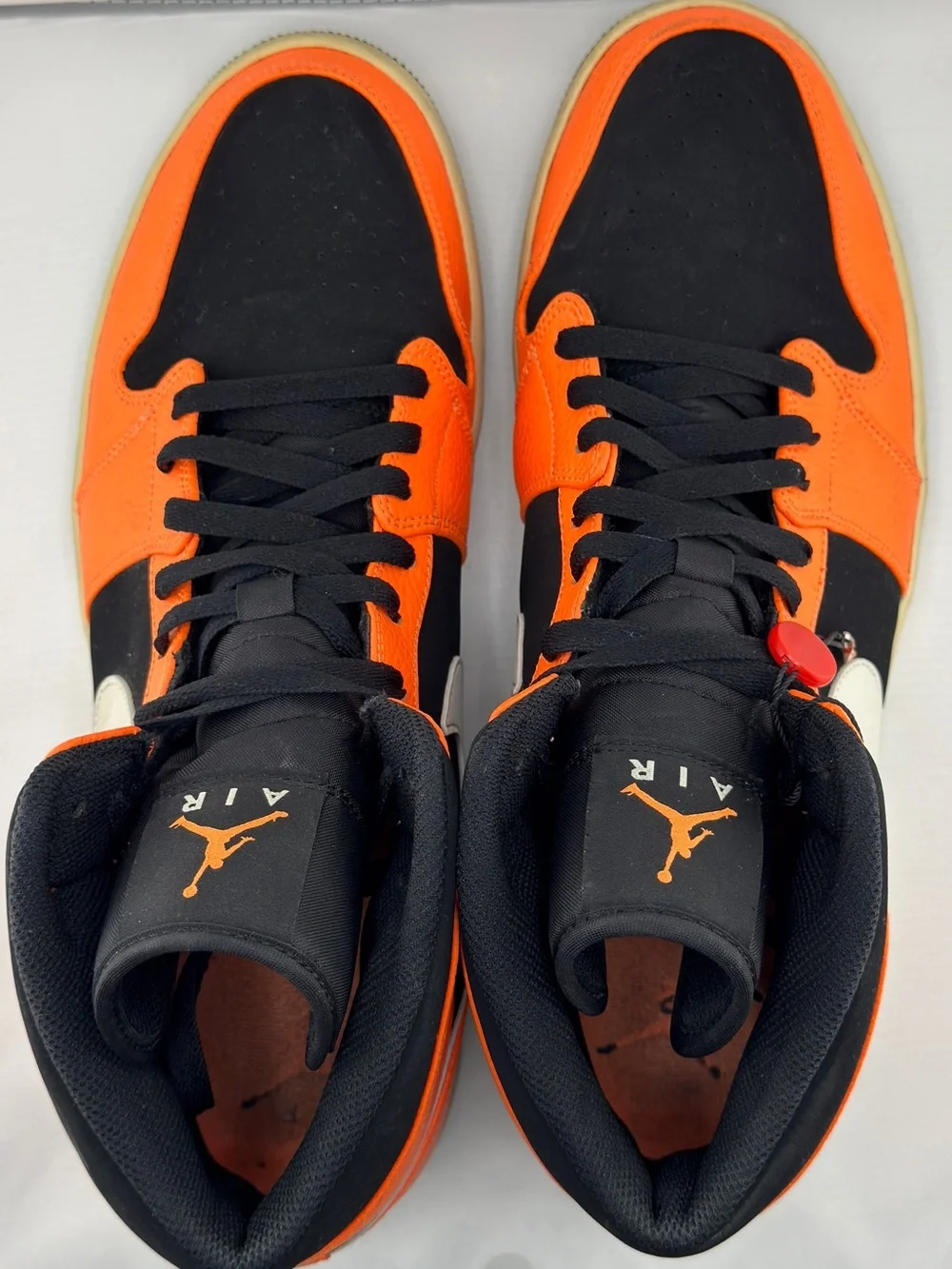 Jordan Black and Orange Mid-Top Sneakers with Cream Swoosh